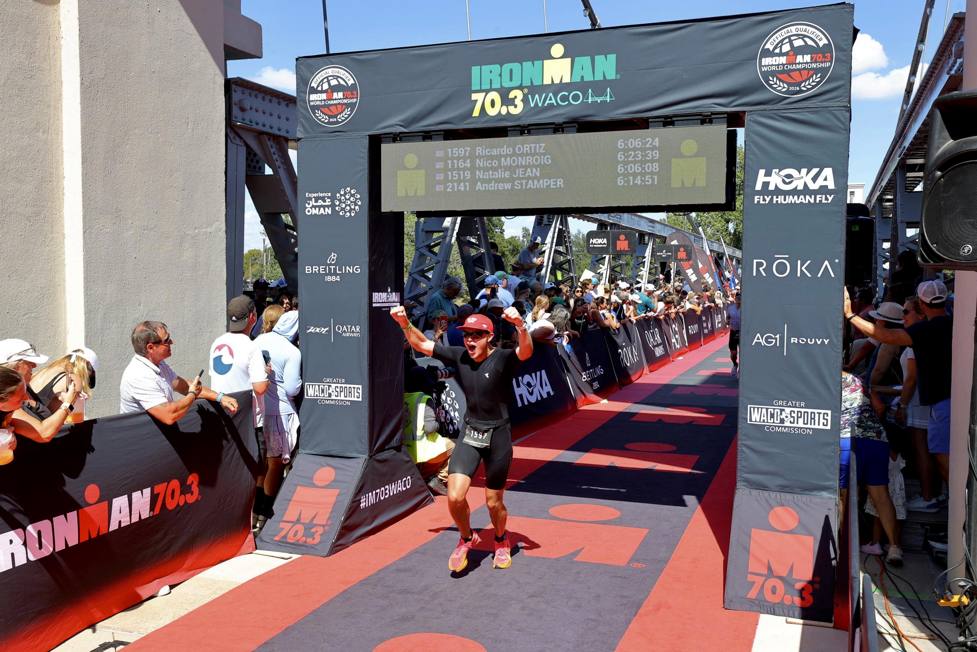 Ricardo finishing a 70.3 race